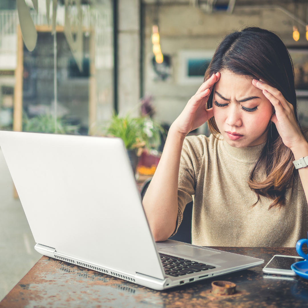 Woman holding head trying not to fall asleep