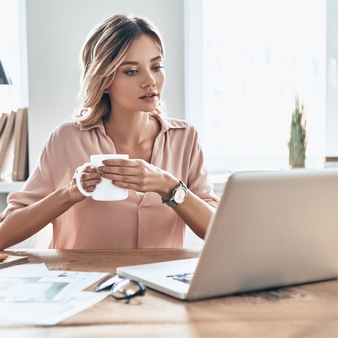 woman-looking-at-computer-at-home