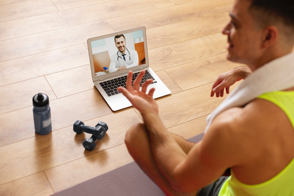 Smiling patient using a laptop to order health tests online from home
